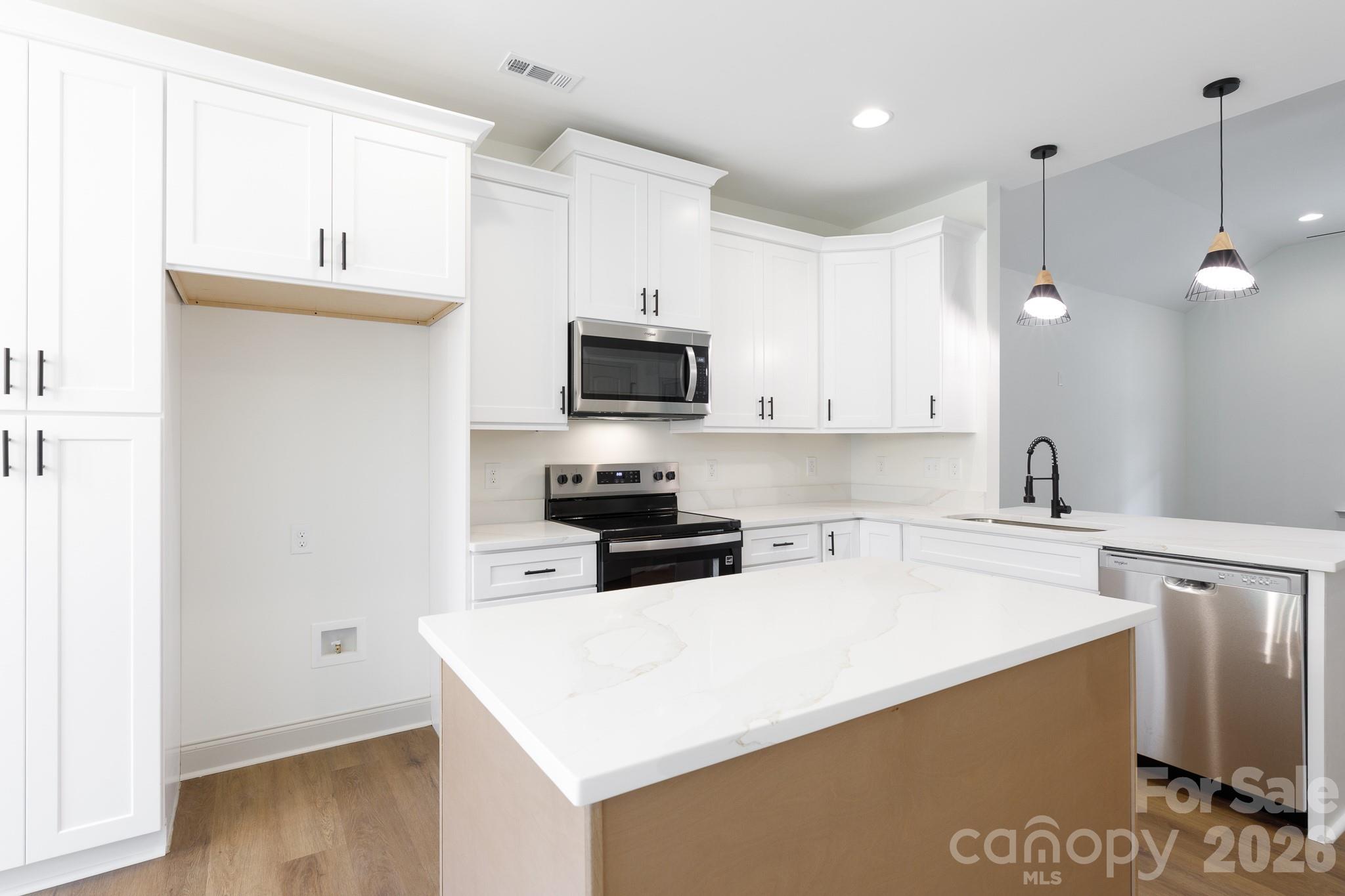 107 Brown Street, Unit 12 Clover, SC 29710 - Photo 9 of 33 a kitchen with a sink a stove and refrigerator