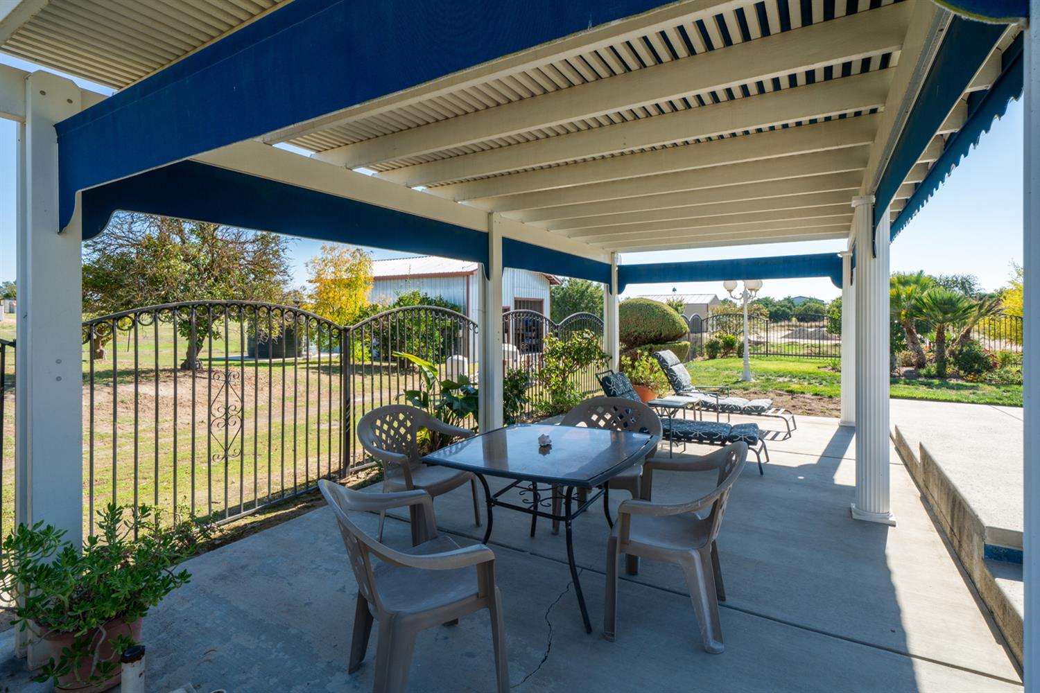 16861 Paula Road Madera, CA 93636 - Photo 44 of 55 a dining room with furniture and garden view