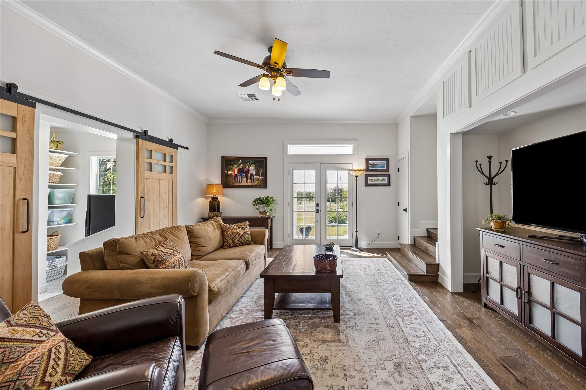 10222 Old Stagecoach Road Chappell Hill, TX 77426 - Photo 21 of 42 a living room with furniture and a flat screen tv