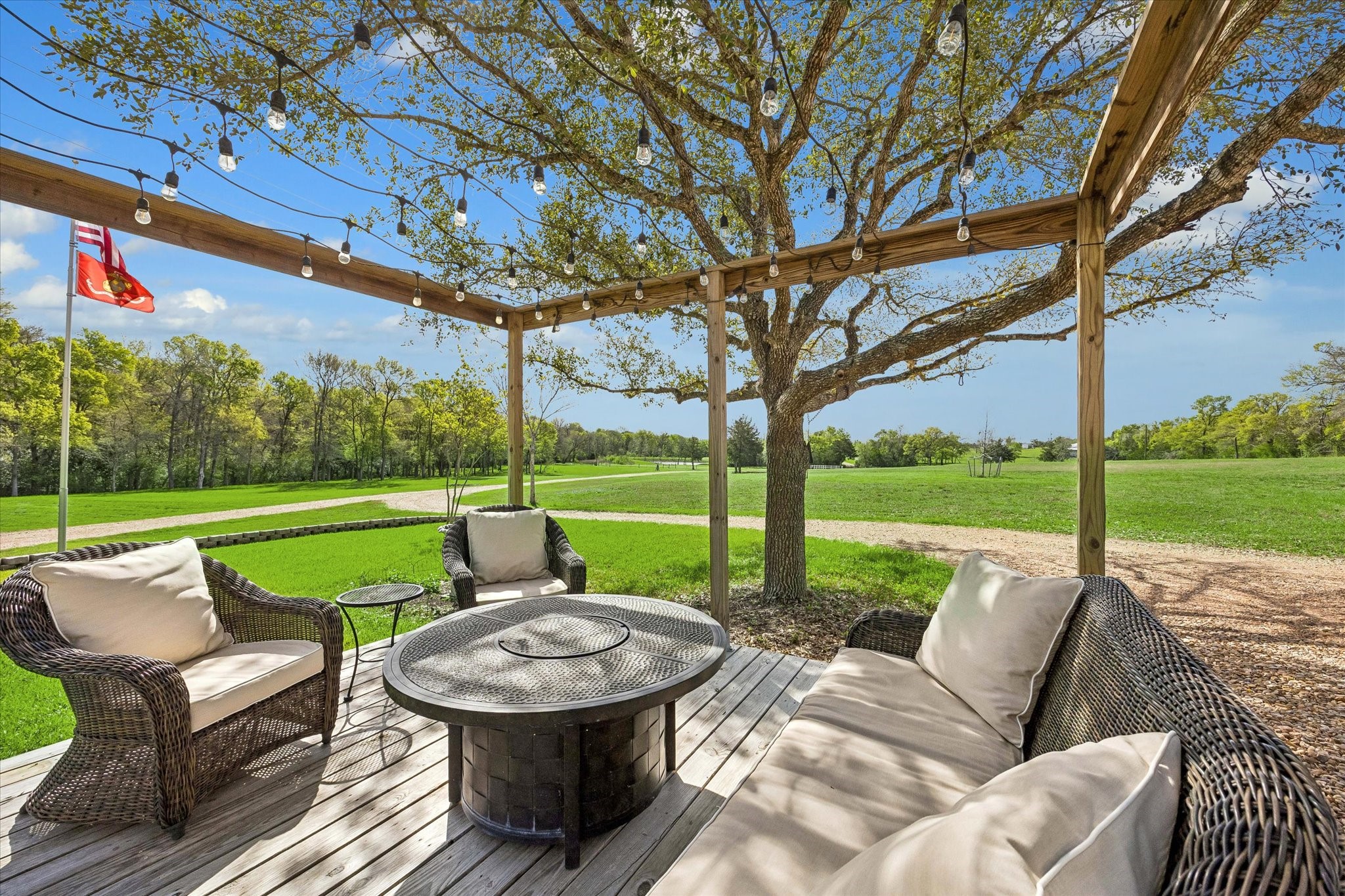 10222 Old Stagecoach Road Chappell Hill, TX 77426 - Photo 37 of 42 a view of a patio with couches chairs and a big yard
