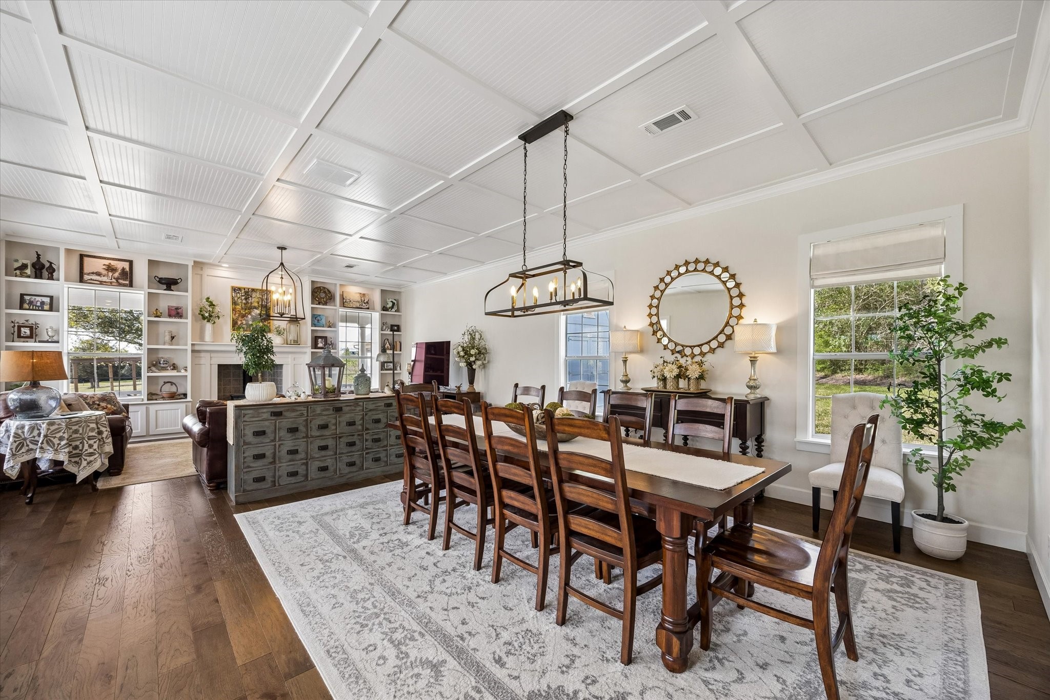 10222 Old Stagecoach Road Chappell Hill, TX 77426 - Photo 6 of 42 a view of a dining room and livingroom with furniture wooden floor a chandelier