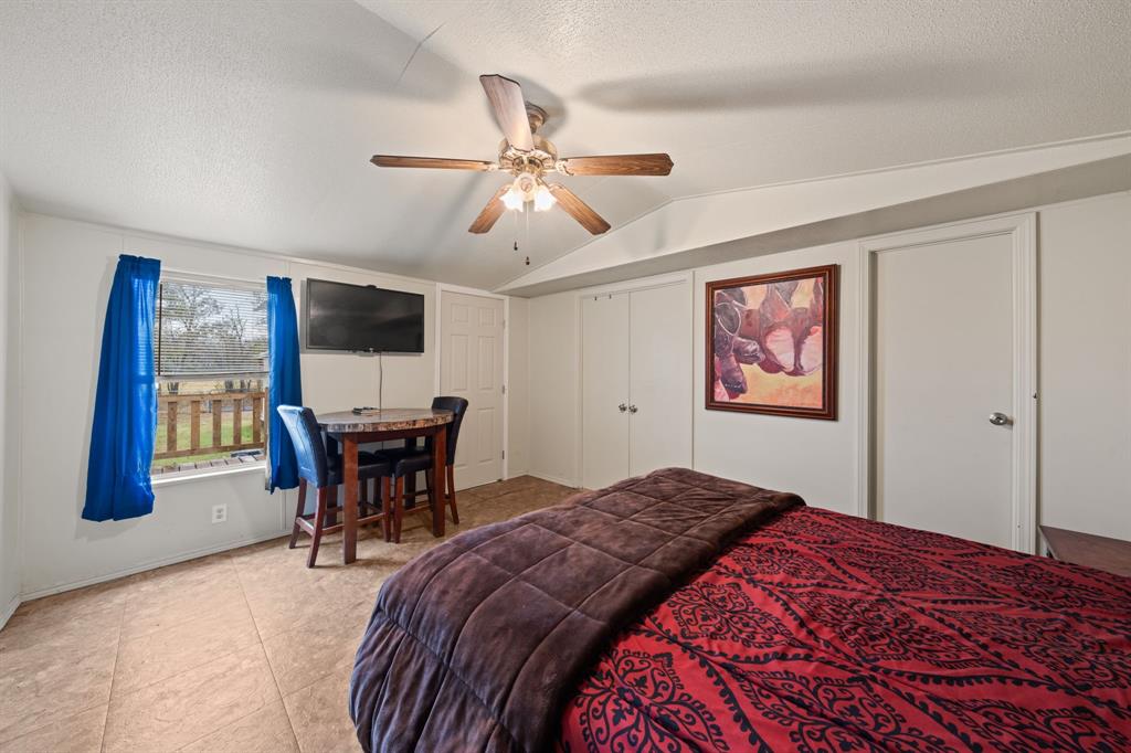 1304 Rains County Road 1530 Point, TX 75472 - Photo 17 of 40 a bedroom that has a bed and a chair in it