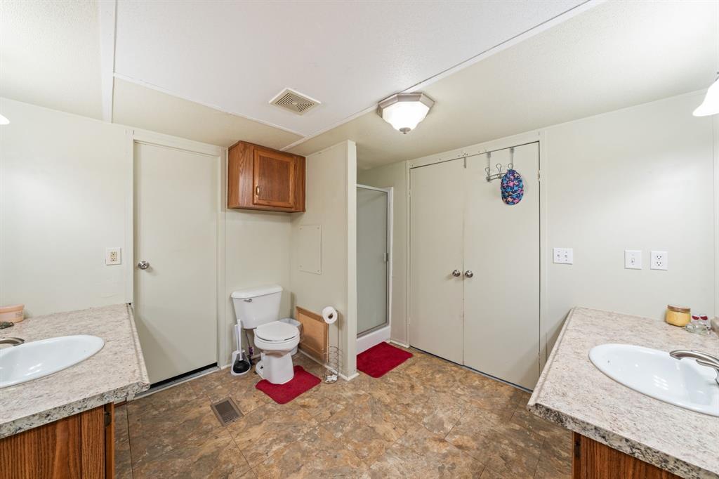 1304 Rains County Road 1530 Point, TX 75472 - Photo 20 of 40 a bathroom with a sink toilet and shower