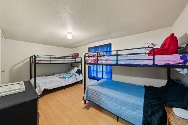 a bedroom with a bed and window