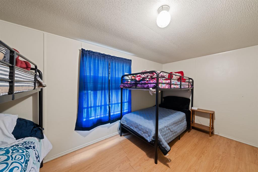 1304 Rains County Road 1530 Point, TX 75472 - Photo 22 of 40 a living room with furniture and a dresser