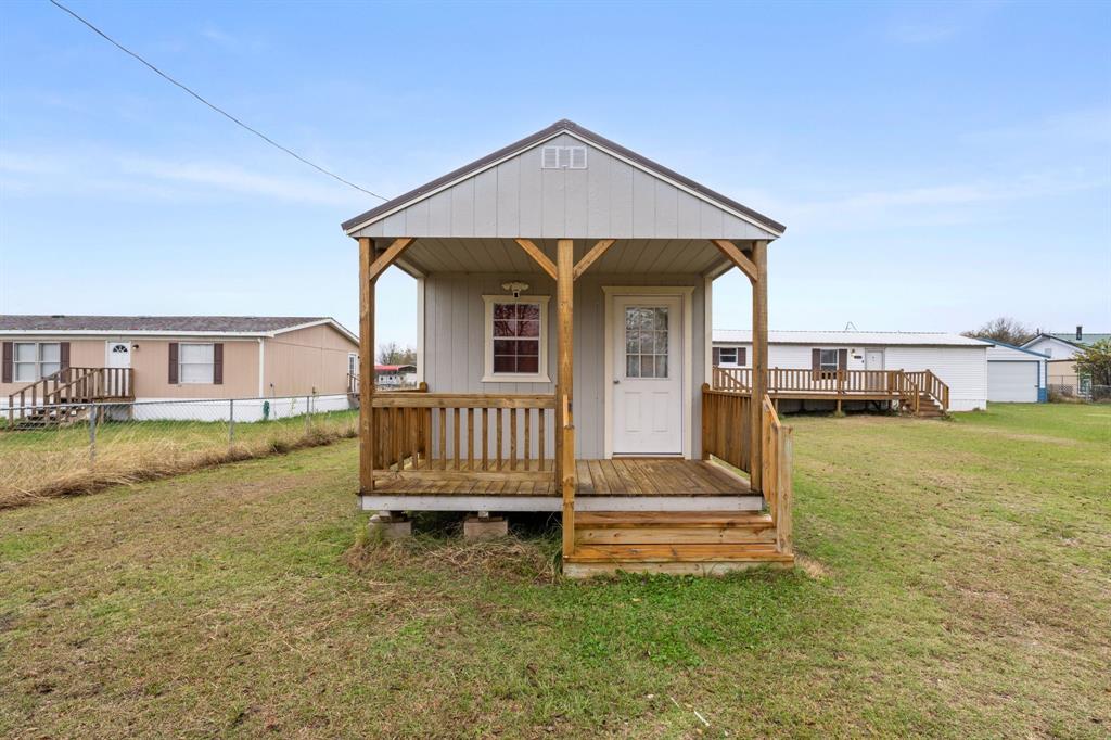 1304 Rains County Road 1530 Point, TX 75472 - Photo 27 of 40 a front view of a house with a yard table and chairs