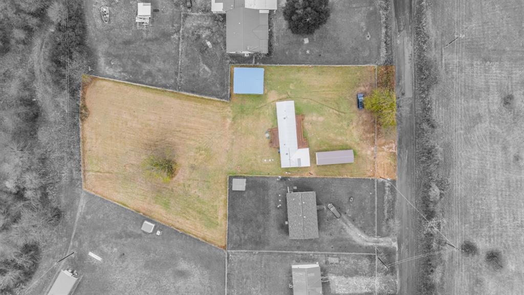 1304 Rains County Road 1530 Point, TX 75472 - Photo 36 of 40 a bathroom with a granite countertop shower and a sink