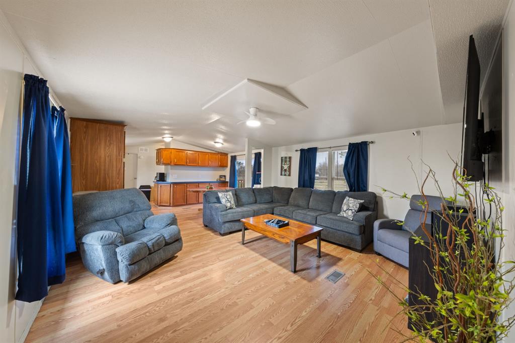 1304 Rains County Road 1530 Point, TX 75472 - Photo 4 of 40 a living room with furniture and a flat screen tv