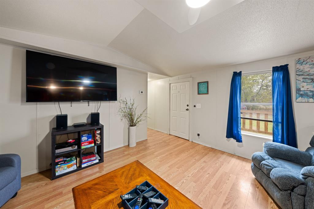 1304 Rains County Road 1530 Point, TX 75472 - Photo 7 of 40 a living room with furniture and a flat screen tv