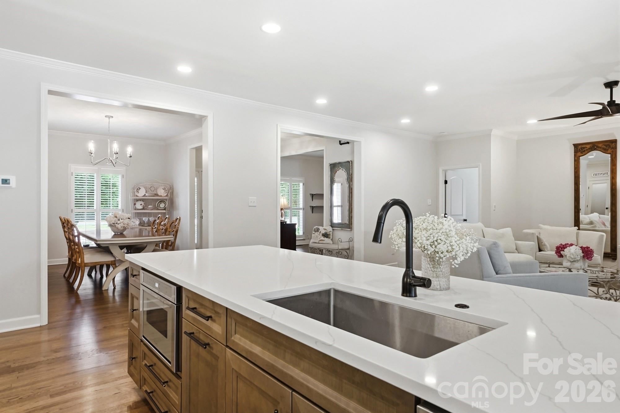 1136 Concord Road Davidson, NC 28036 - Photo 10 of 34 a kitchen with kitchen island a sink table and chairs