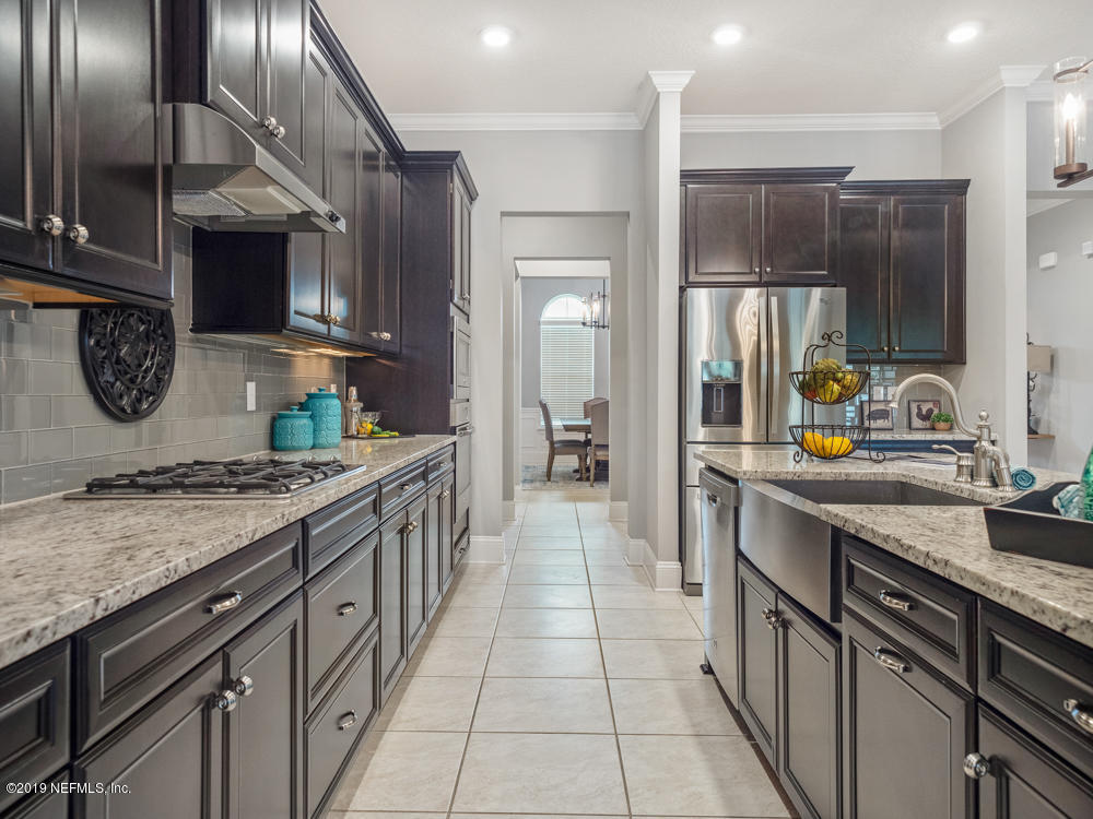 743 Cross Ridge Drive Ponte Vedra, FL 32081 - Photo 18 of 83 a kitchen with a sink stove and cabinets