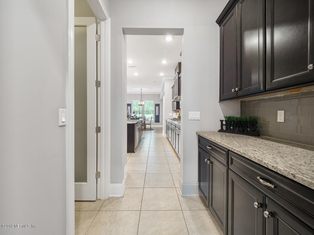743 Cross Ridge Drive Ponte Vedra, FL 32081 - Photo 19 of 83 a kitchen with stainless steel appliances granite countertop a refrigerator and a sink