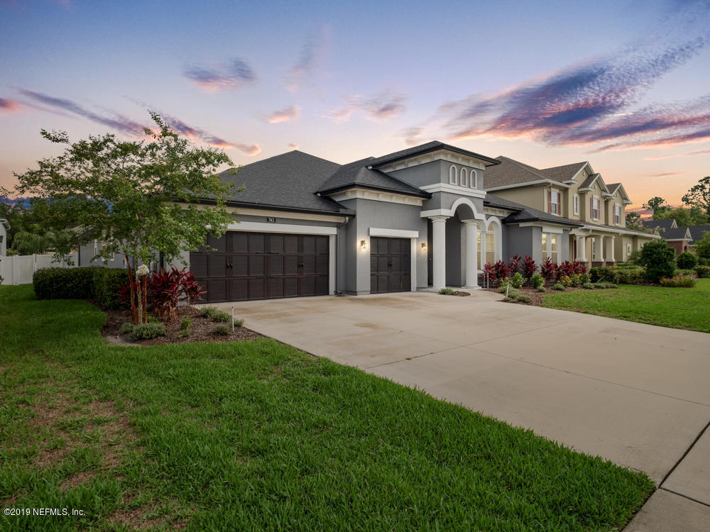 743 Cross Ridge Drive Ponte Vedra, FL 32081 - Photo 2 of 83 a front view of a house with a garden and plants
