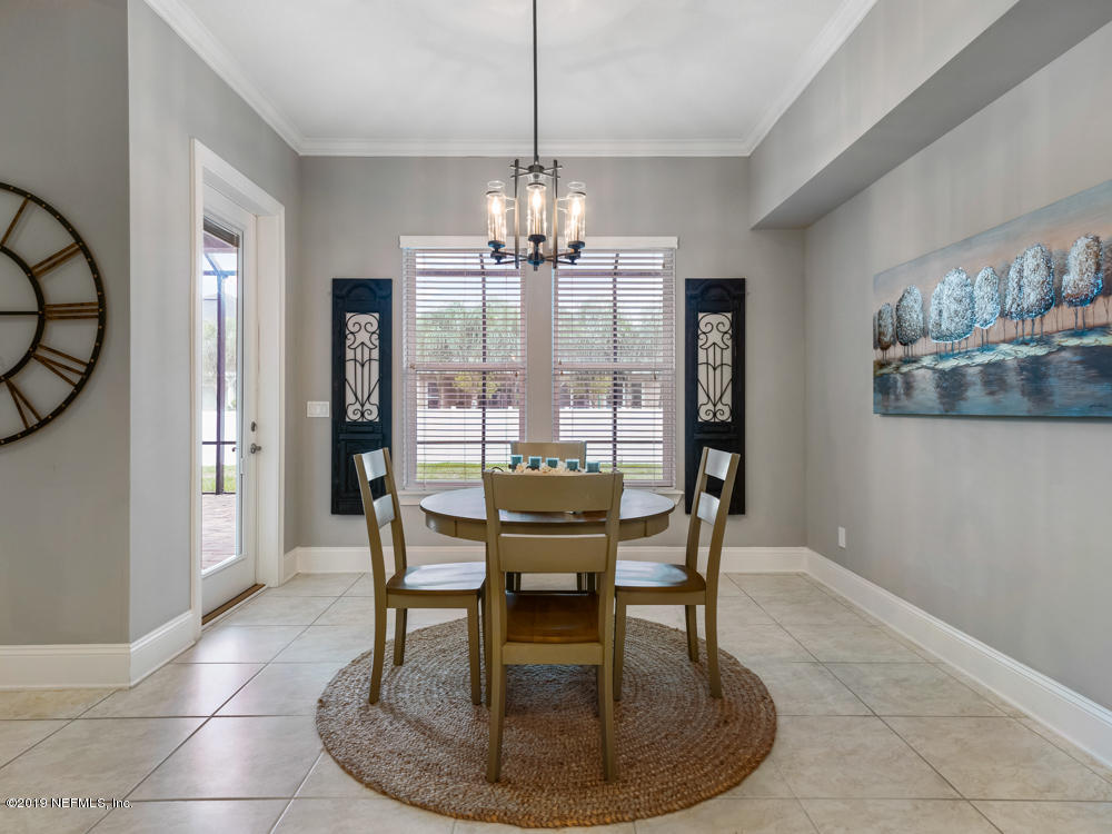 743 Cross Ridge Drive Ponte Vedra, FL 32081 - Photo 21 of 83 a view of a dining room with furniture window and wooden floor