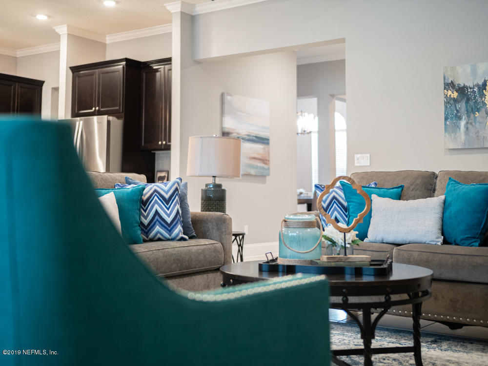 743 Cross Ridge Drive Ponte Vedra, FL 32081 - Photo 28 of 83 a living room with furniture and a refrigerator