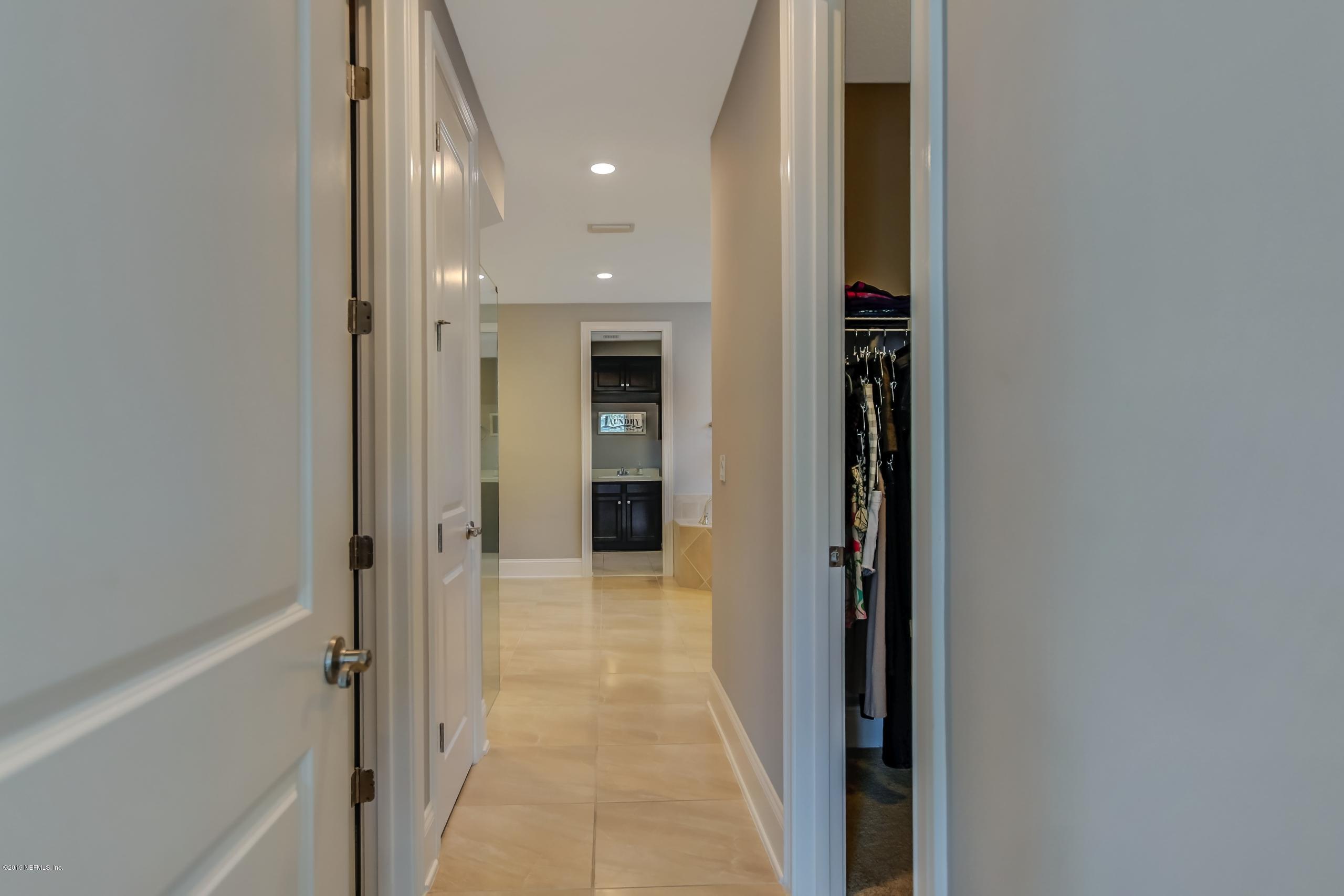 743 Cross Ridge Drive Ponte Vedra, FL 32081 - Photo 29 of 83 a view of a hallway with wooden floor and a bathroom