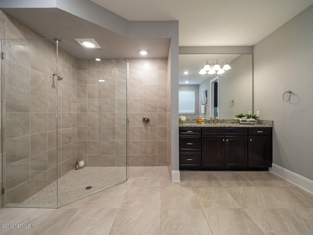 743 Cross Ridge Drive Ponte Vedra, FL 32081 - Photo 31 of 83 a bathroom with a shower a sink and a mirror