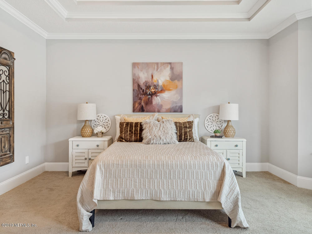 743 Cross Ridge Drive Ponte Vedra, FL 32081 - Photo 38 of 83 a bedroom with a bed and a painting on the wall