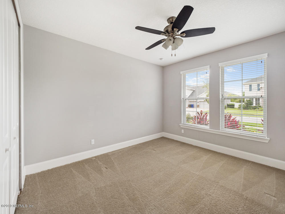 743 Cross Ridge Drive Ponte Vedra, FL 32081 - Photo 47 of 83 an empty room with window and ceiling fan