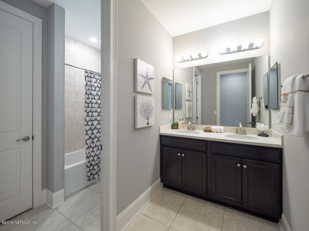 743 Cross Ridge Drive Ponte Vedra, FL 32081 - Photo 48 of 83 a bathroom with a double vanity sink and a mirror