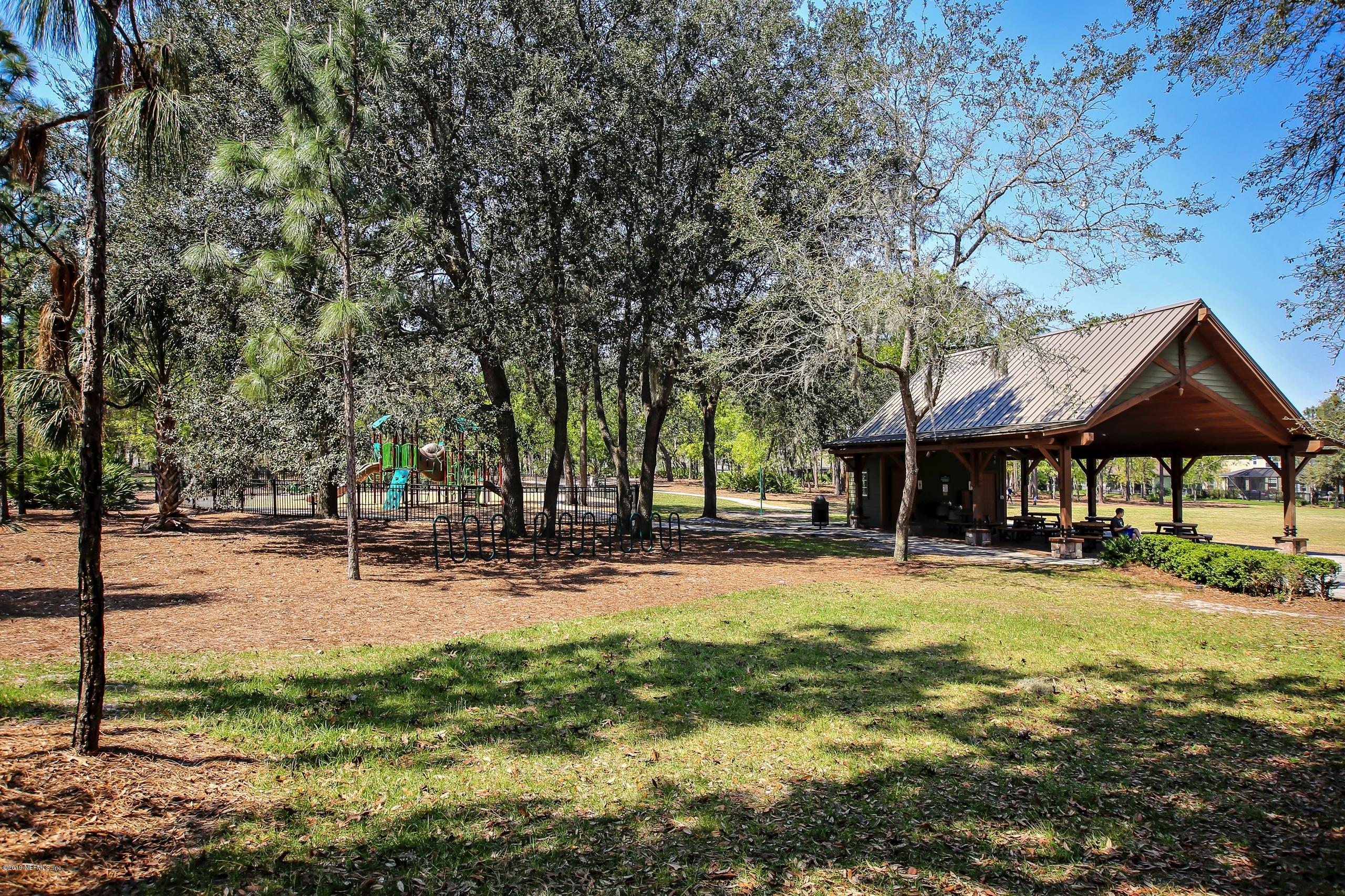 743 Cross Ridge Drive Ponte Vedra, FL 32081 - Photo 65 of 83 a backyard of a house with table and chairs