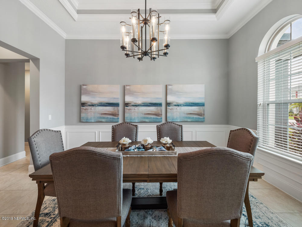 743 Cross Ridge Drive Ponte Vedra, FL 32081 - Photo 9 of 83 a dining room with furniture a chandelier and window
