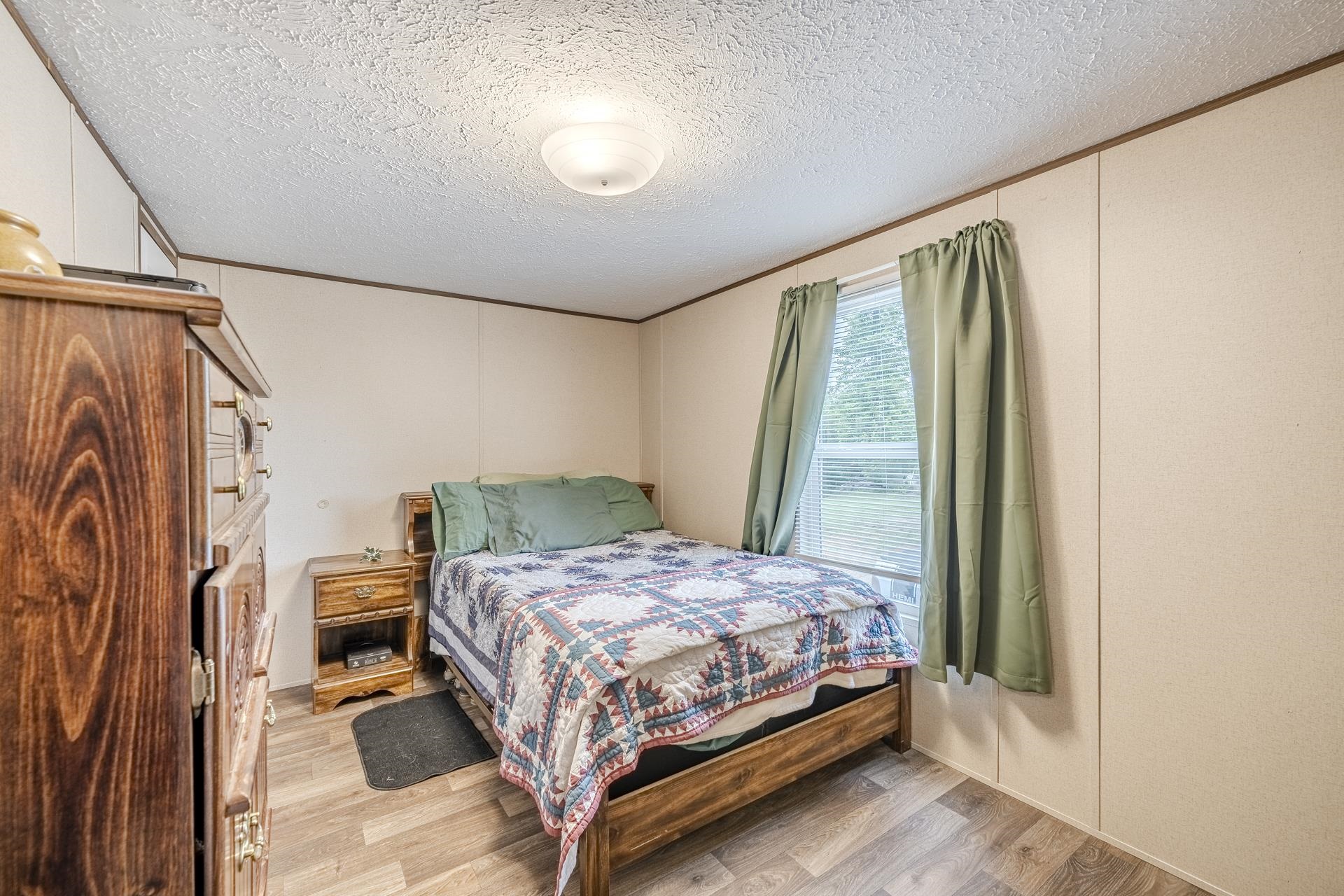 3275 Glendale Road Adamsville, TN 38310 - Photo 27 of 39 a bedroom with a bed and a window