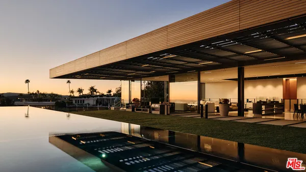 a view of a swimming pool with a patio