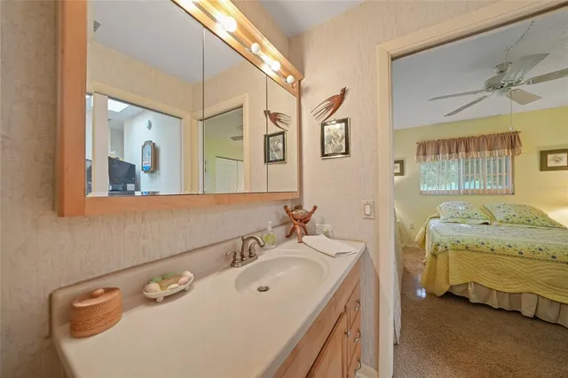 a bedroom with a bed and a lamp on table