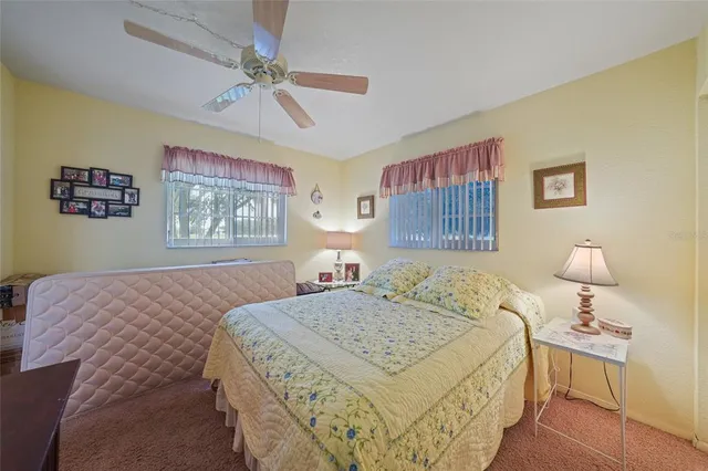 a bathroom with a double vanity sink toilet mirror and shower