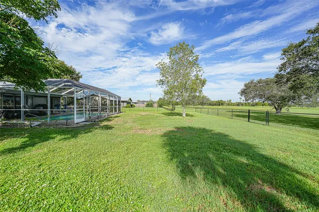 a view of a house with a big yard