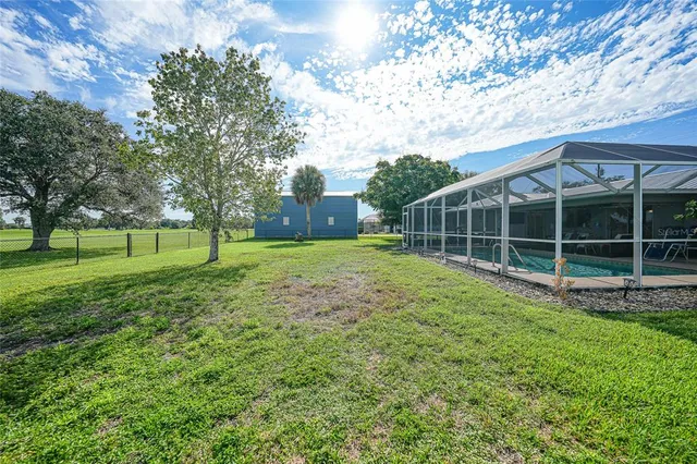a view of a park with large trees