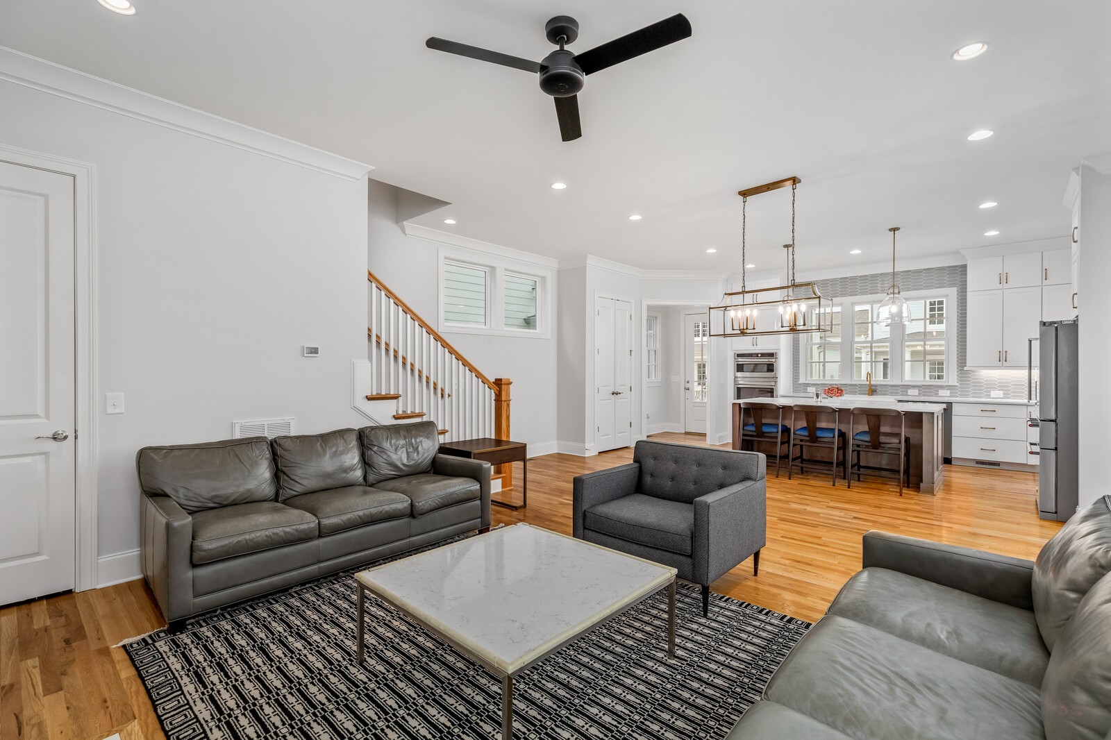 844 Horizon Drive Franklin, TN 37064 - Photo 18 of 48 a living room with furniture a ceiling fan and a rug