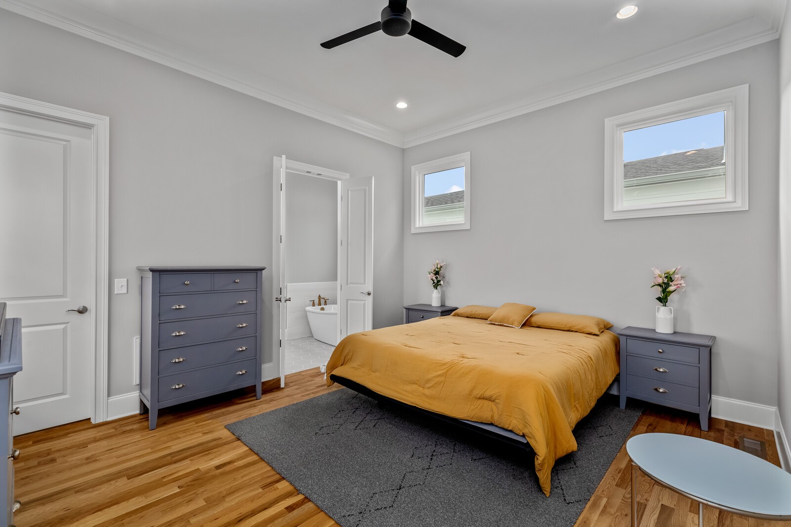 844 Horizon Drive Franklin, TN 37064 - Photo 20 of 48 a bedroom with a bed a dresser and a chandelier