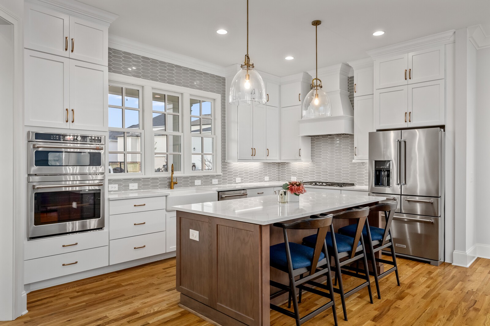 844 Horizon Drive Franklin, TN 37064 - Photo 5 of 48 a kitchen with stainless steel appliances kitchen island granite countertop a table chairs stove and cabinets