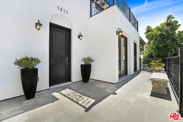 a view of a door and chair in the patio