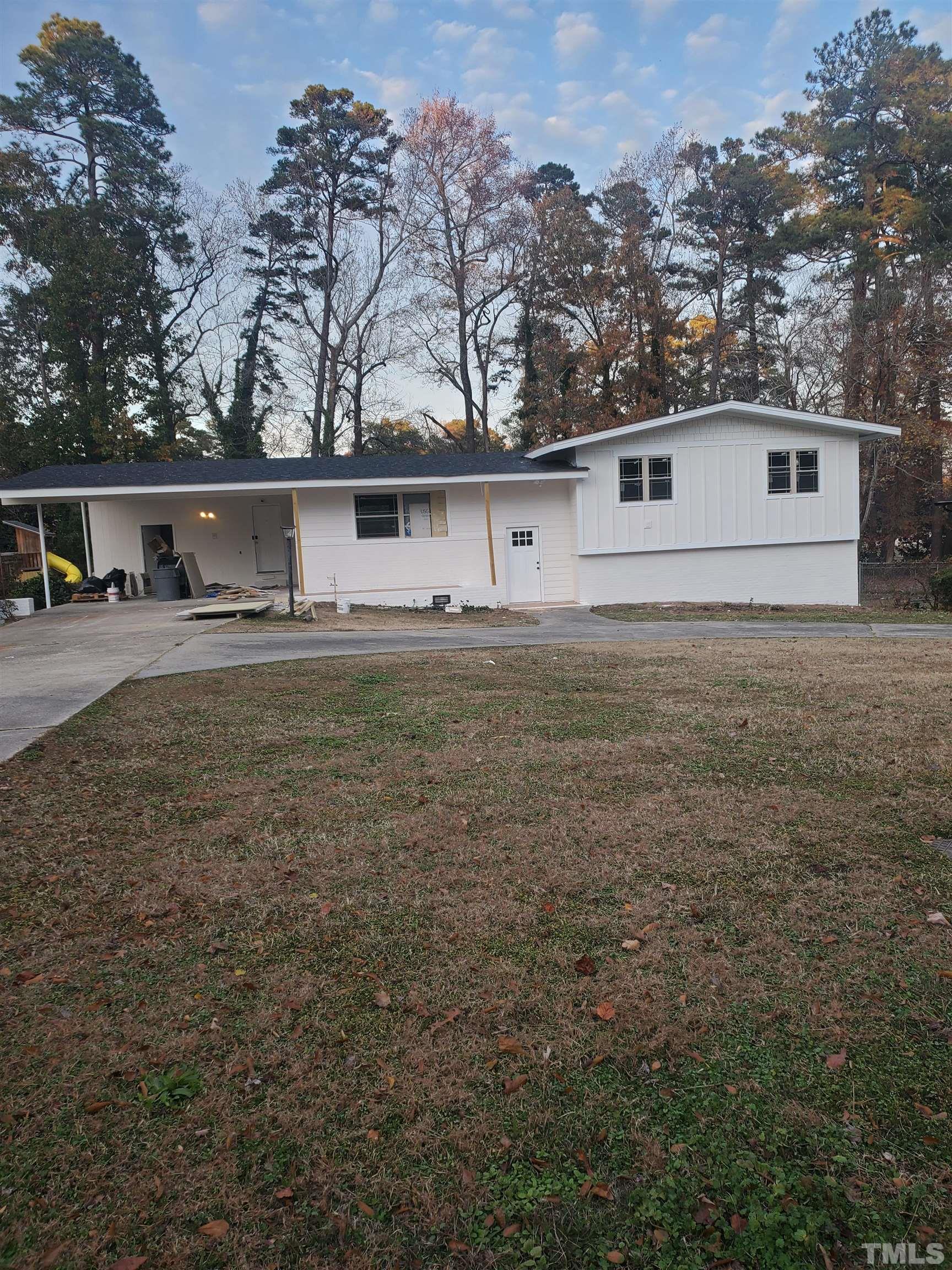 319 Golf Course Drive Raleigh, NC 27610 - Photo 2 of 13 a front view of house with yard