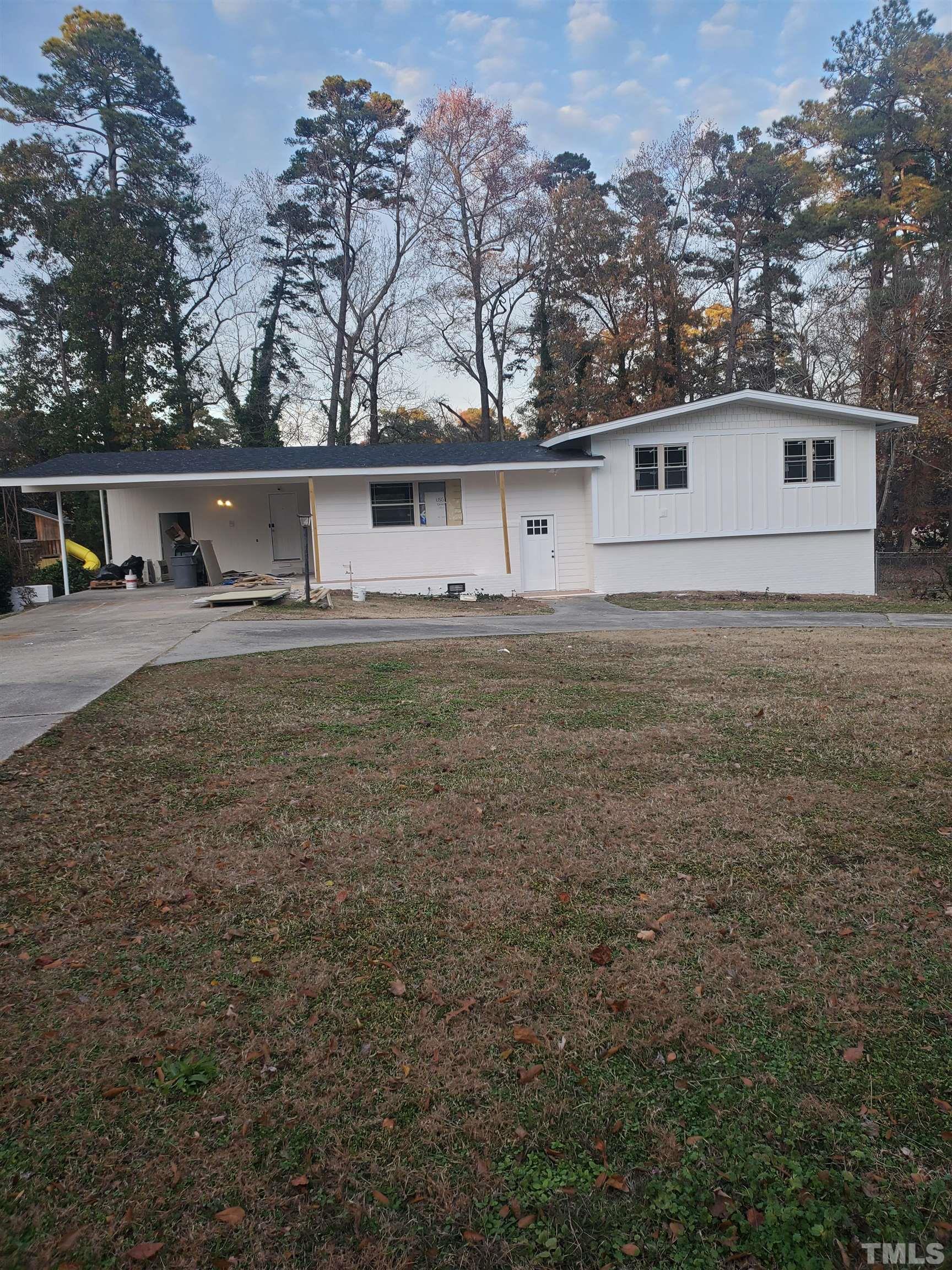 319 Golf Course Drive Raleigh, NC 27610 - Photo 3 of 13 front view of house with a yard