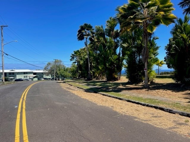 28-2981 Kumula Street Pepeekeo, HI 96783 - Photo 10 of 28 a view of a swimming pool with a house in the background
