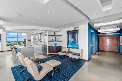 a view of a dining room with furniture wooden floor and chandelier