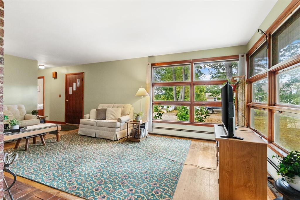 8 Everett Street Wakefield, MA 01880 - Photo 12 of 32 a living room with furniture and a large window