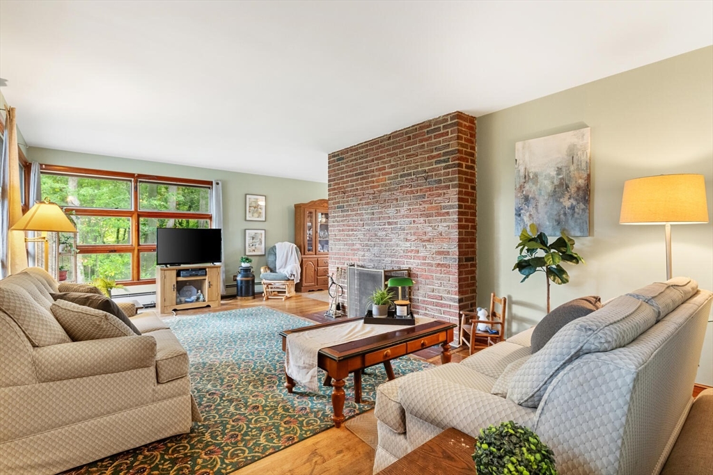 8 Everett Street Wakefield, MA 01880 - Photo 14 of 32 a living room with furniture and a flat screen tv