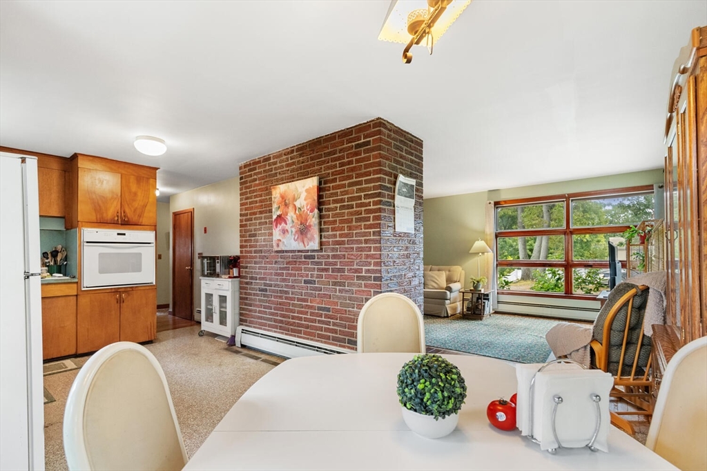 8 Everett Street Wakefield, MA 01880 - Photo 18 of 32 a bedroom with furniture and a large window