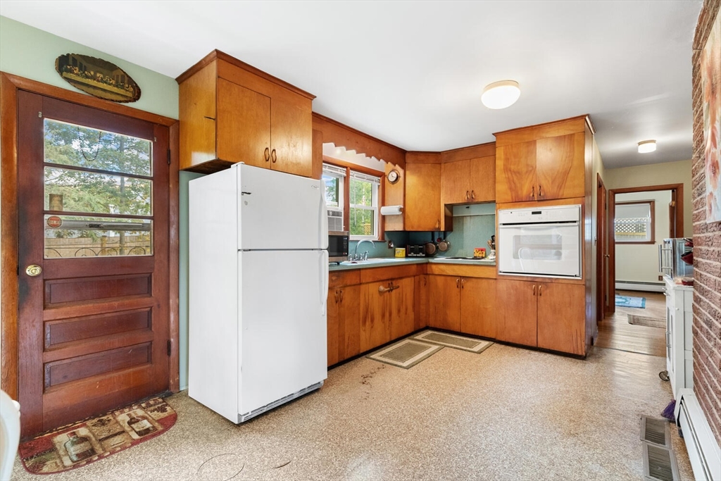 8 Everett Street Wakefield, MA 01880 - Photo 19 of 32 a kitchen with stainless steel appliances a refrigerator and a stove