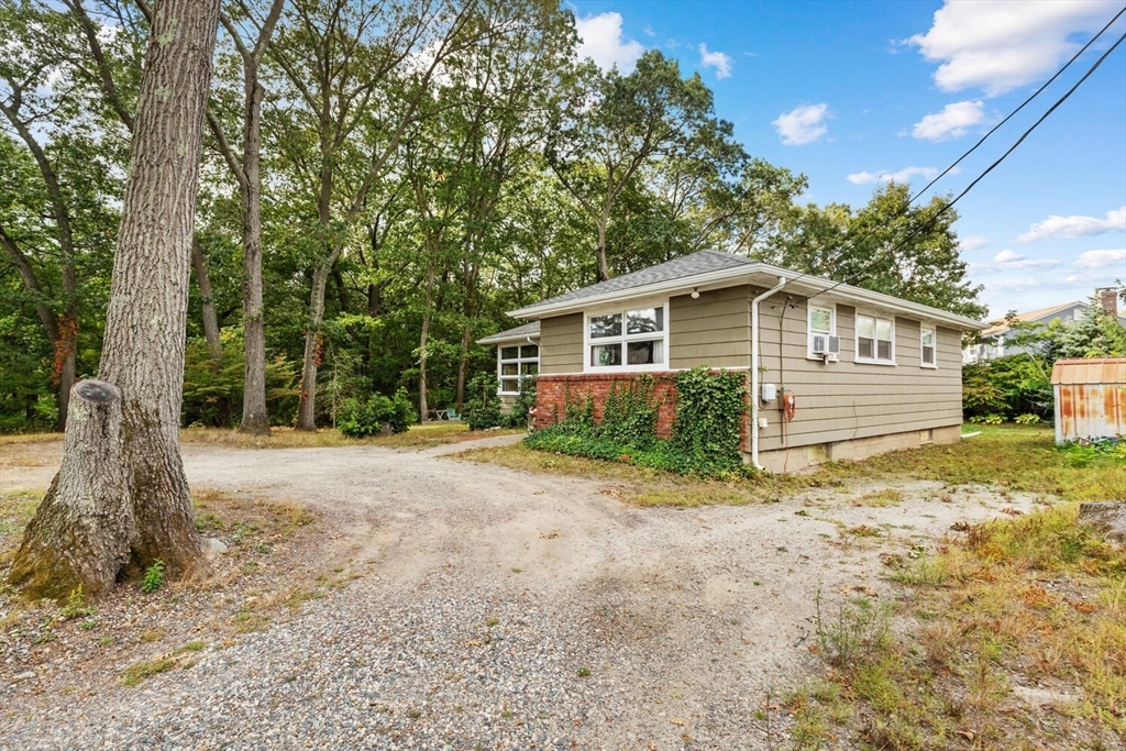 8 Everett Street Wakefield, MA 01880 - Photo 4 of 32 a front view of a house with a garden