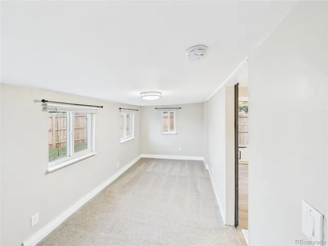 a view of an empty room with a window