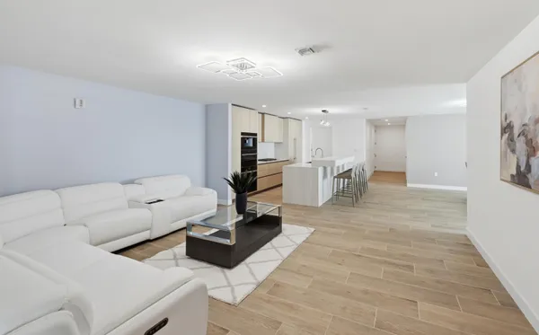 a living room with furniture and a table