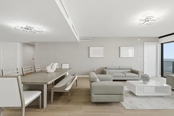 a kitchen with granite countertop a refrigerator and a sink