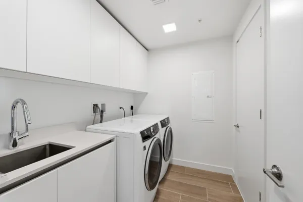 a bedroom with a large bed and a large window