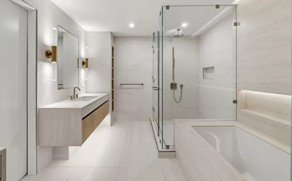 a bathroom with a bathtub and a shower